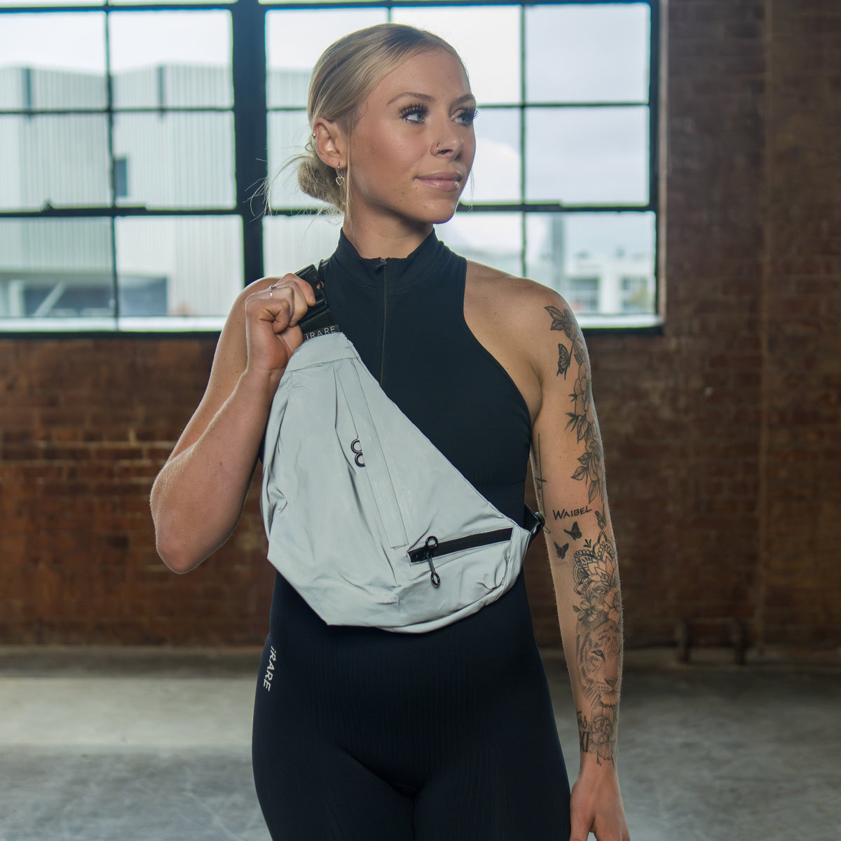 large crossbody sport bag in reflective, on-model crossbody