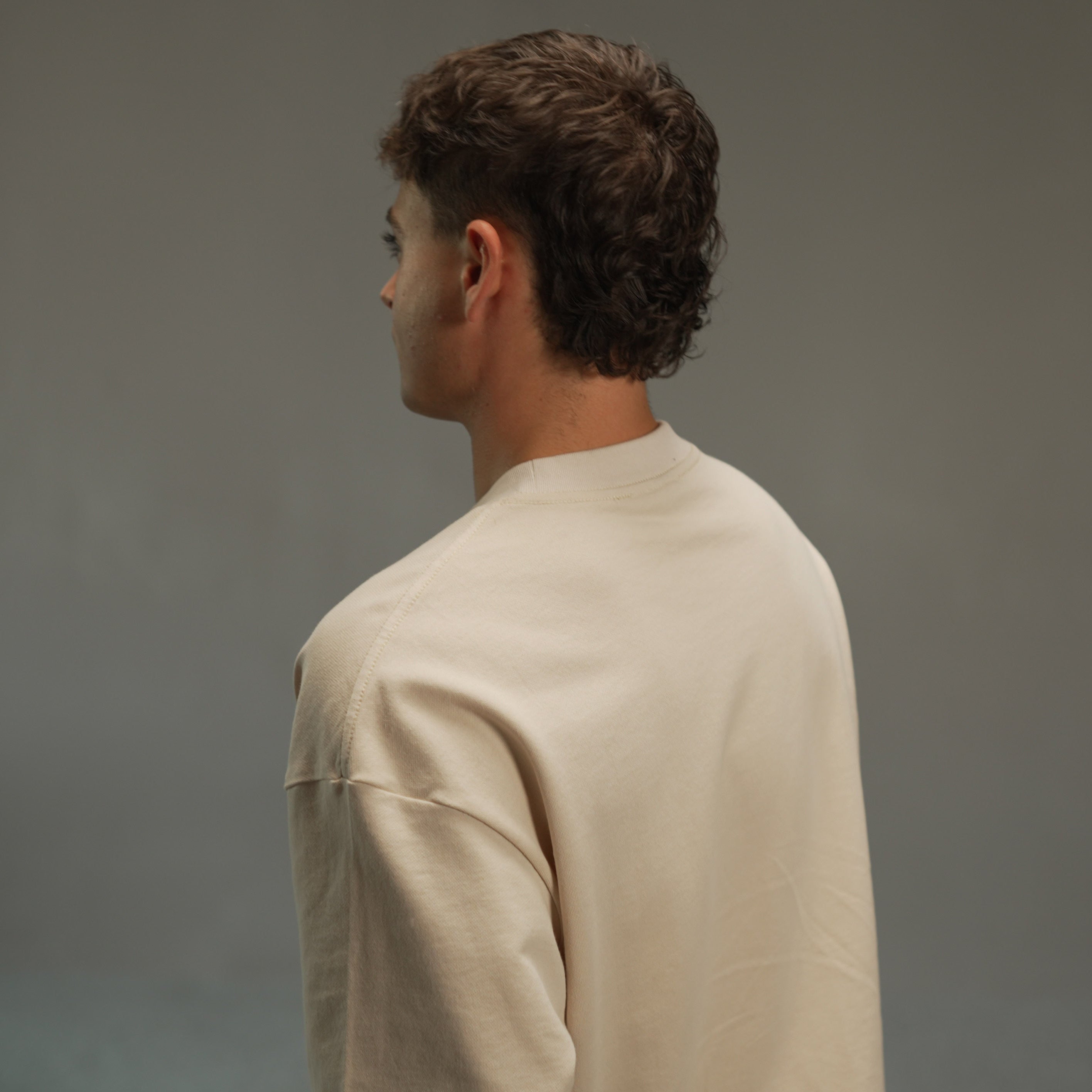 men’s relaxed sweatshirt in khaki, upper-back view