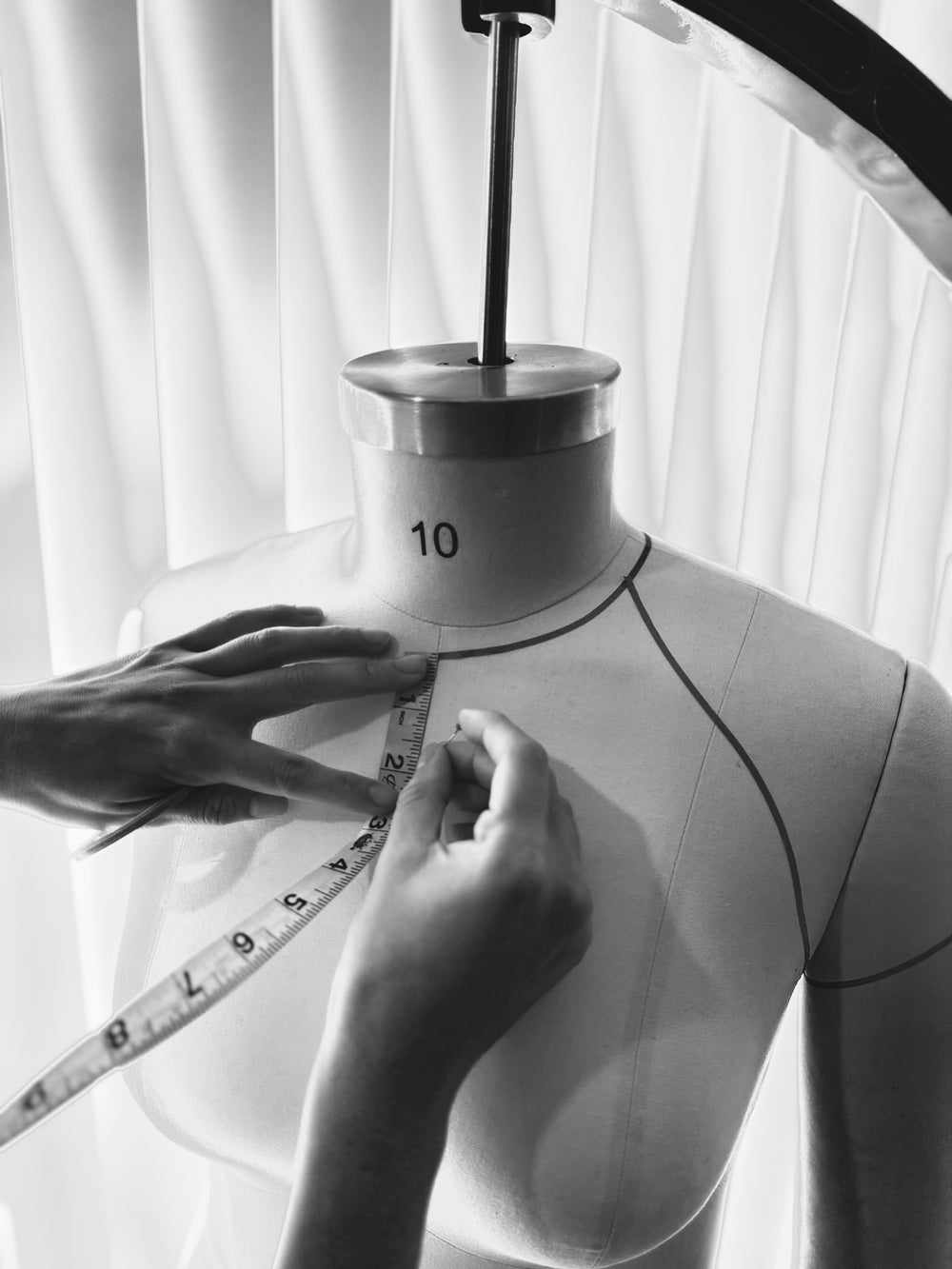 Taking measurements on a dress form