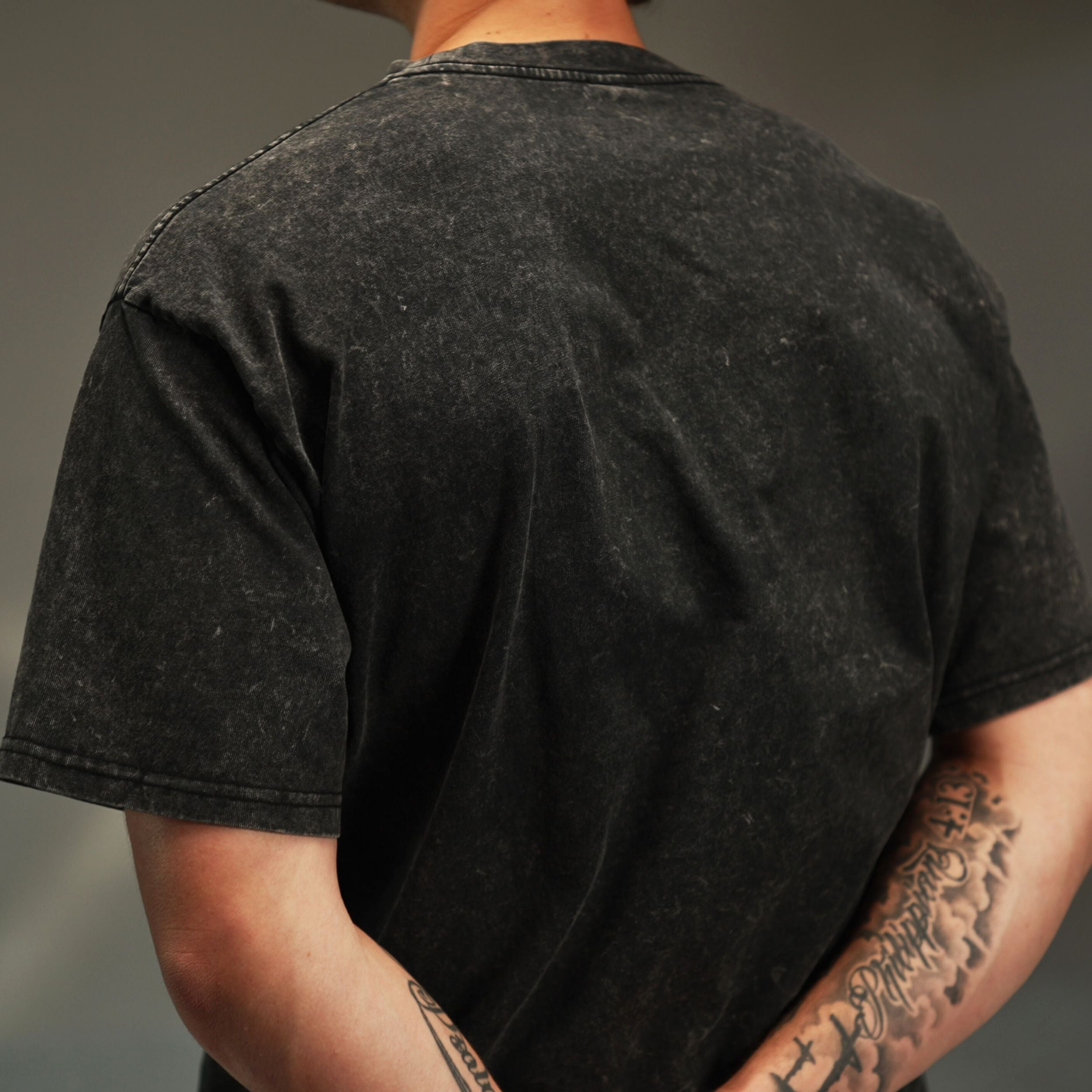 iRARE men’s acid-washed t-shirt in washed black, back view
