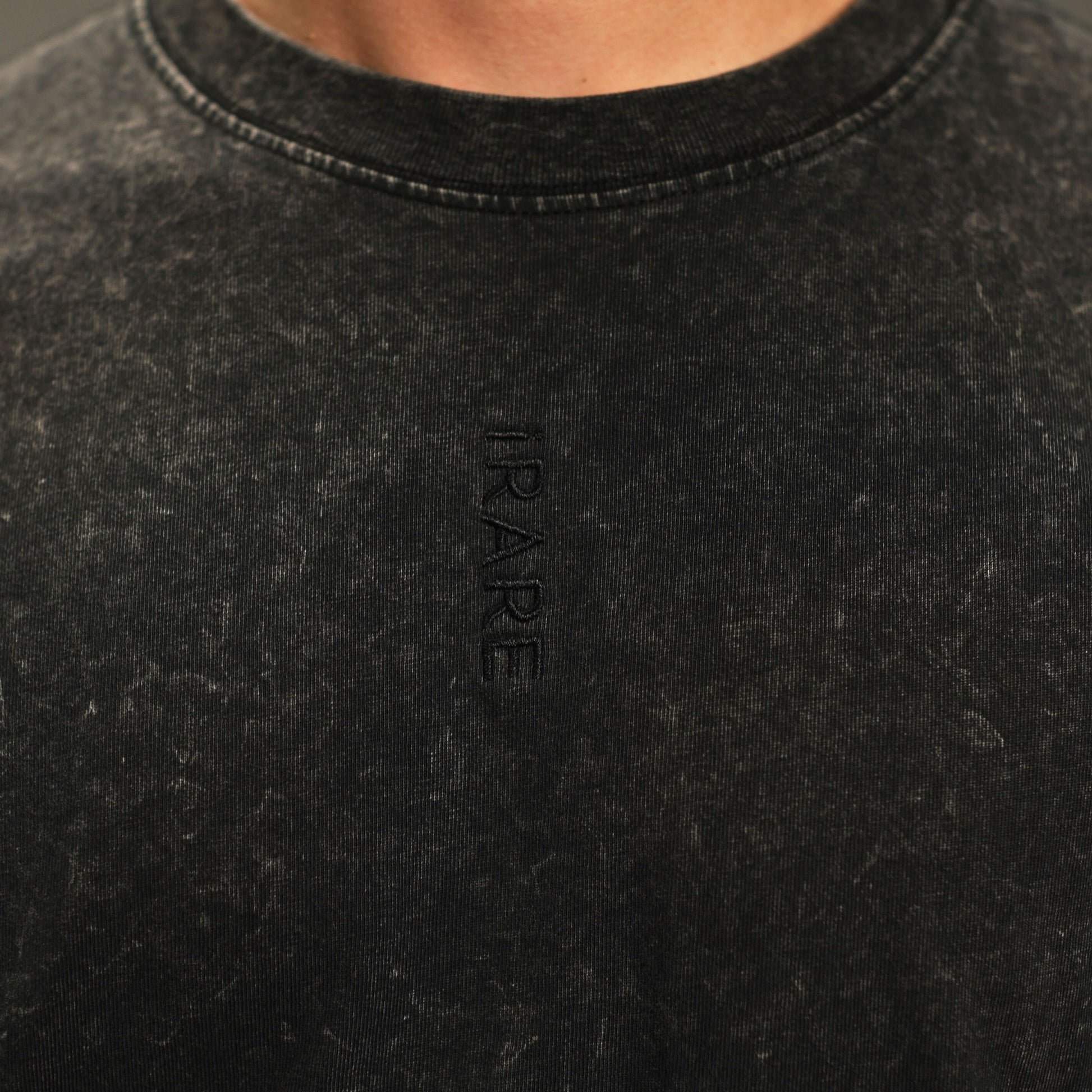 iRARE men’s acid-washed t-shirt in washed black, close up