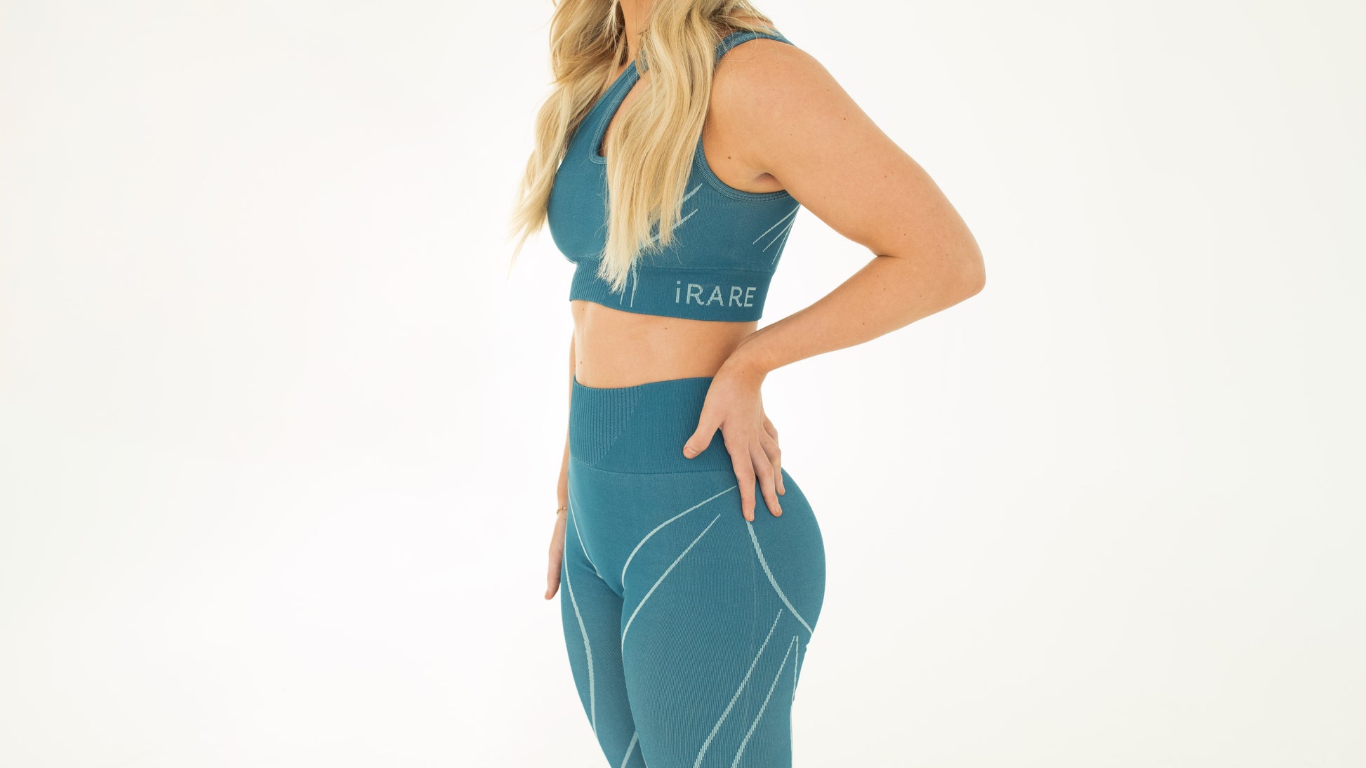 blue one-shoulder seamless sport bra, studio side view