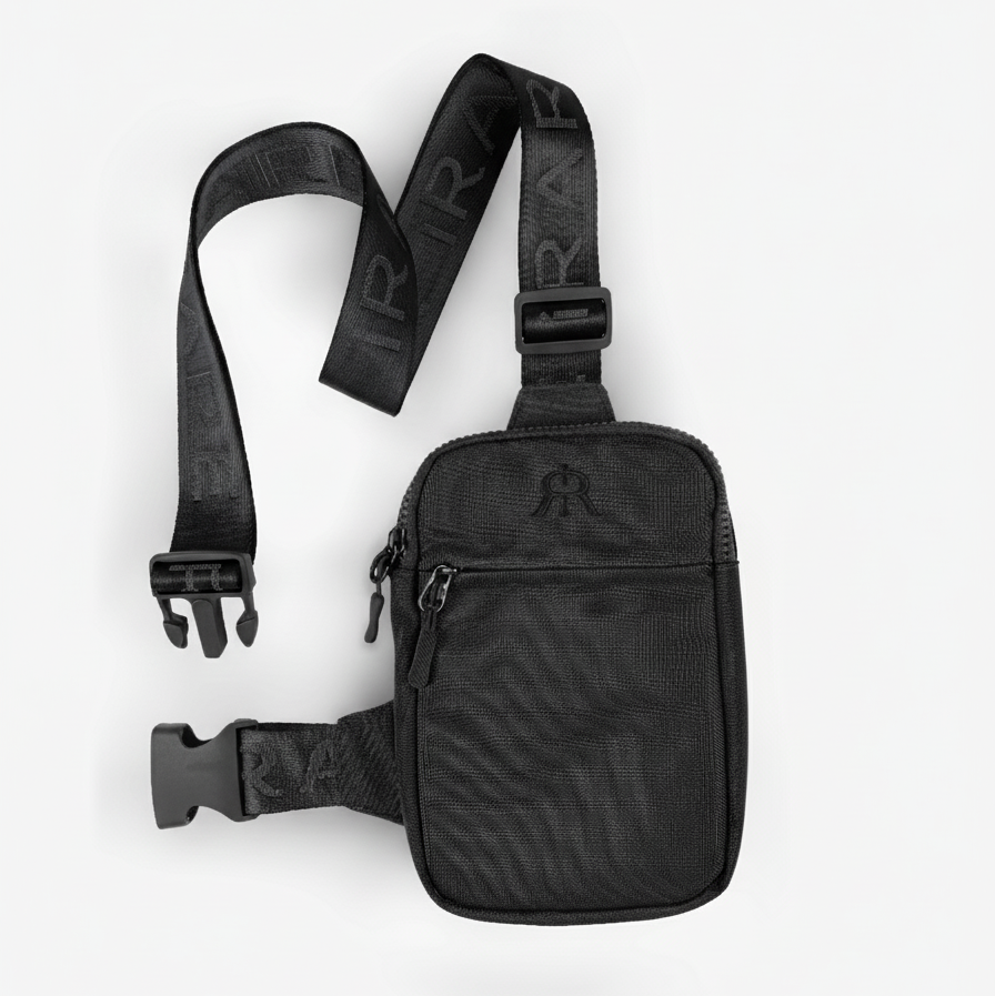 Black crossbody bag with front zip pocket and woven adjustable strap