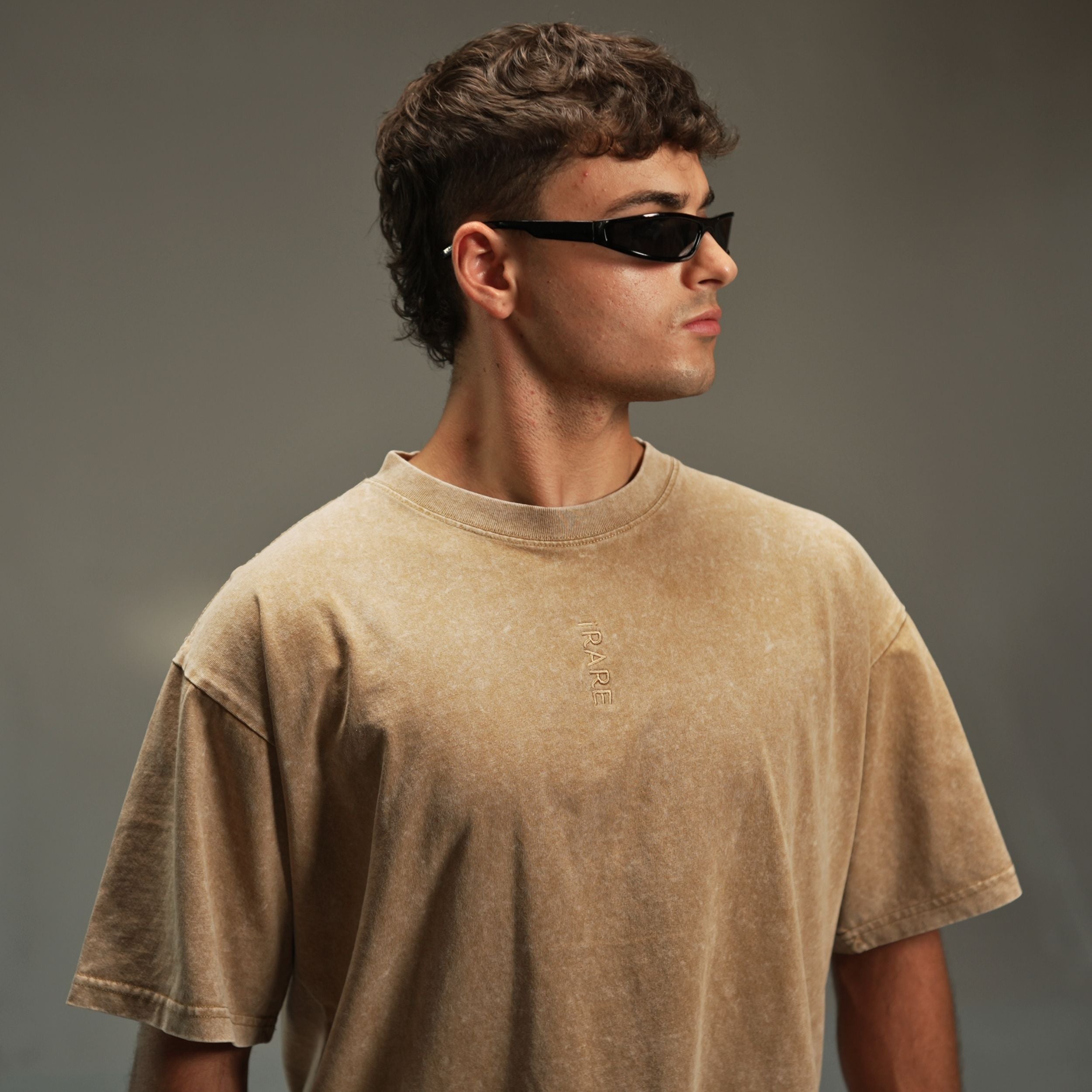 iRARE men’s acid-washed t-shirt in washed sand, front view