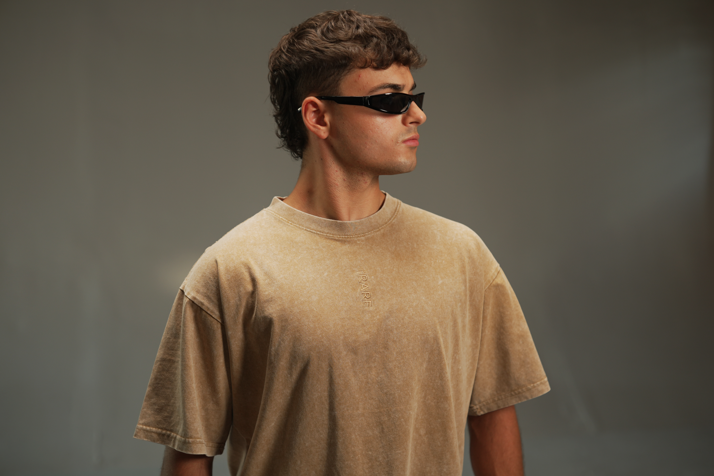iRARE men’s acid-washed t-shirt in washed sand, front view