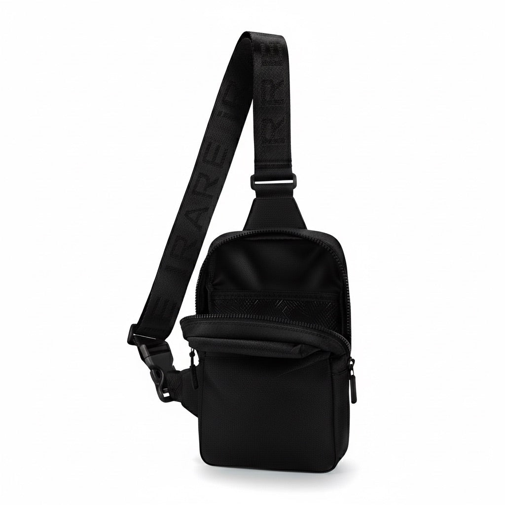 iRARE black crossbody bag open view showing interior in a minimal studio setting