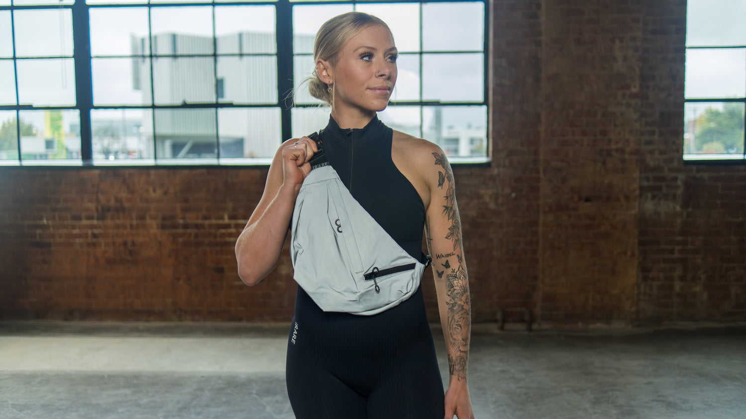 large crossbody sport bag in reflective, on-model crossbody