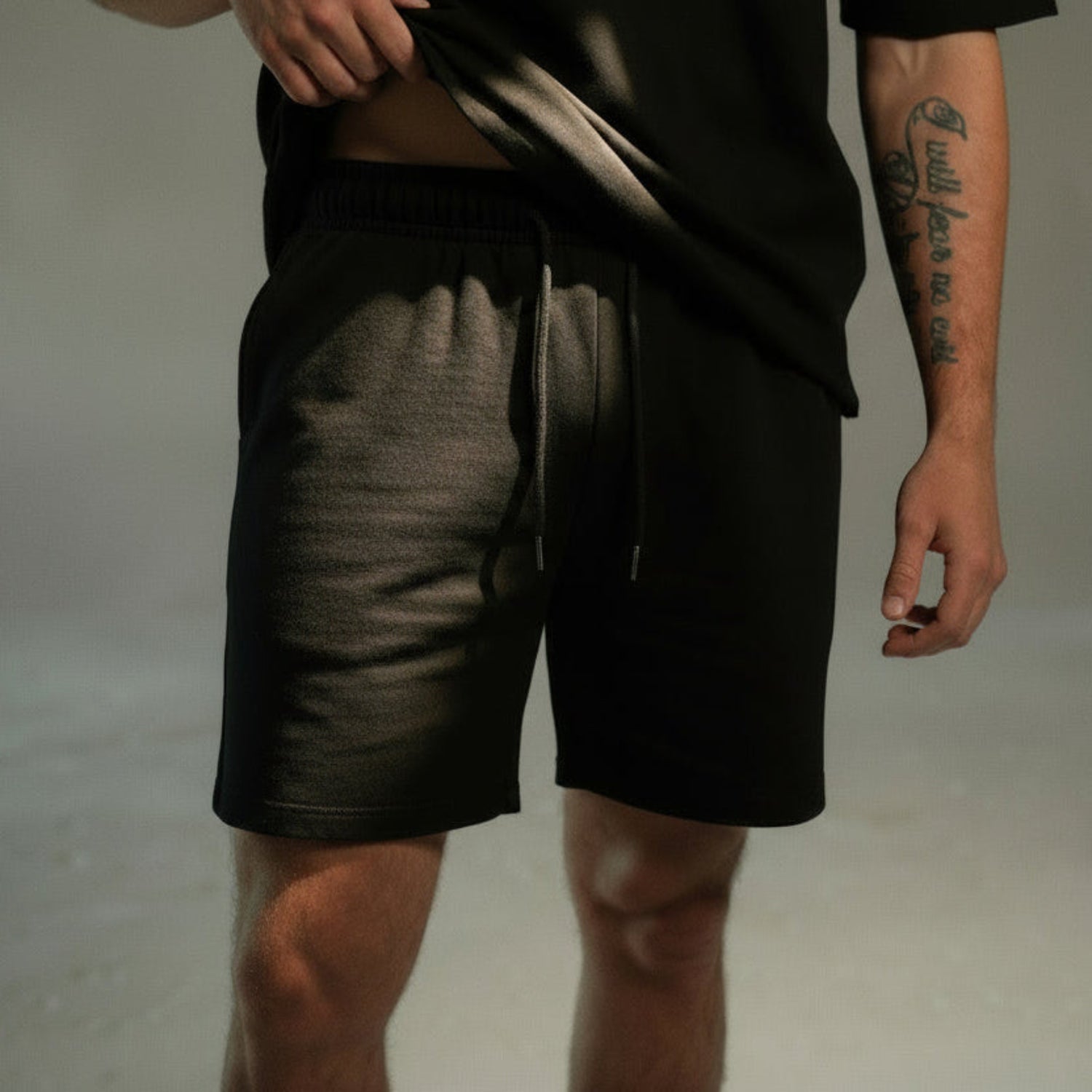men’s relaxed sweat shorts in black, front view