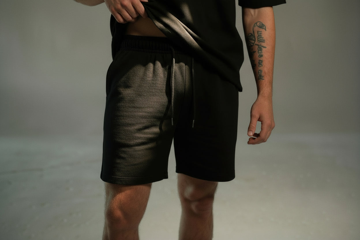 men’s relaxed sweat shorts in black, front view