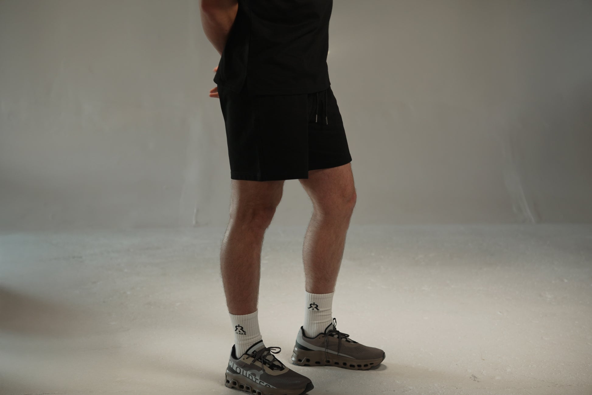 men’s relaxed sweat shorts in black, side view