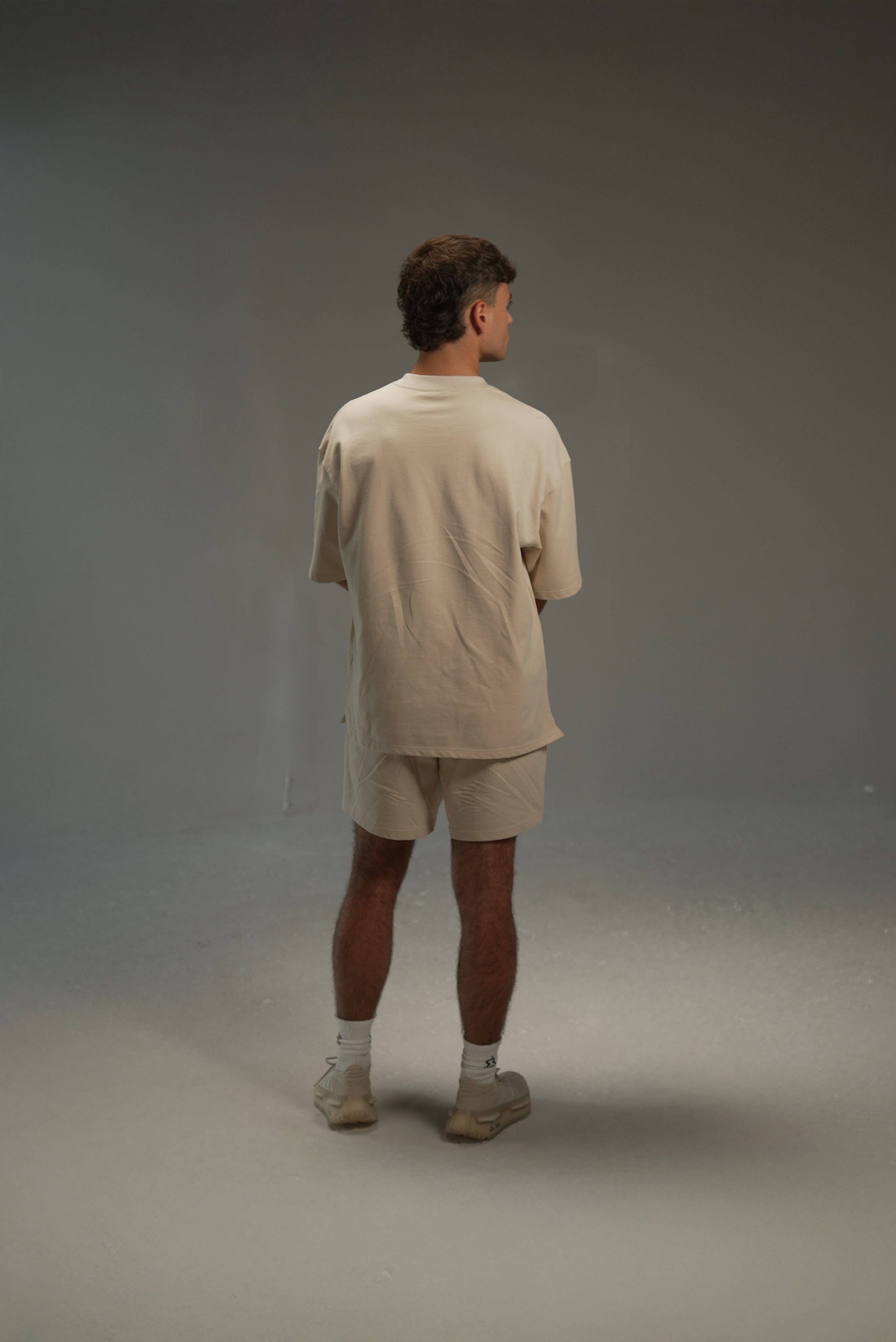 men’s relaxed sweat shorts in khaki, on-model back