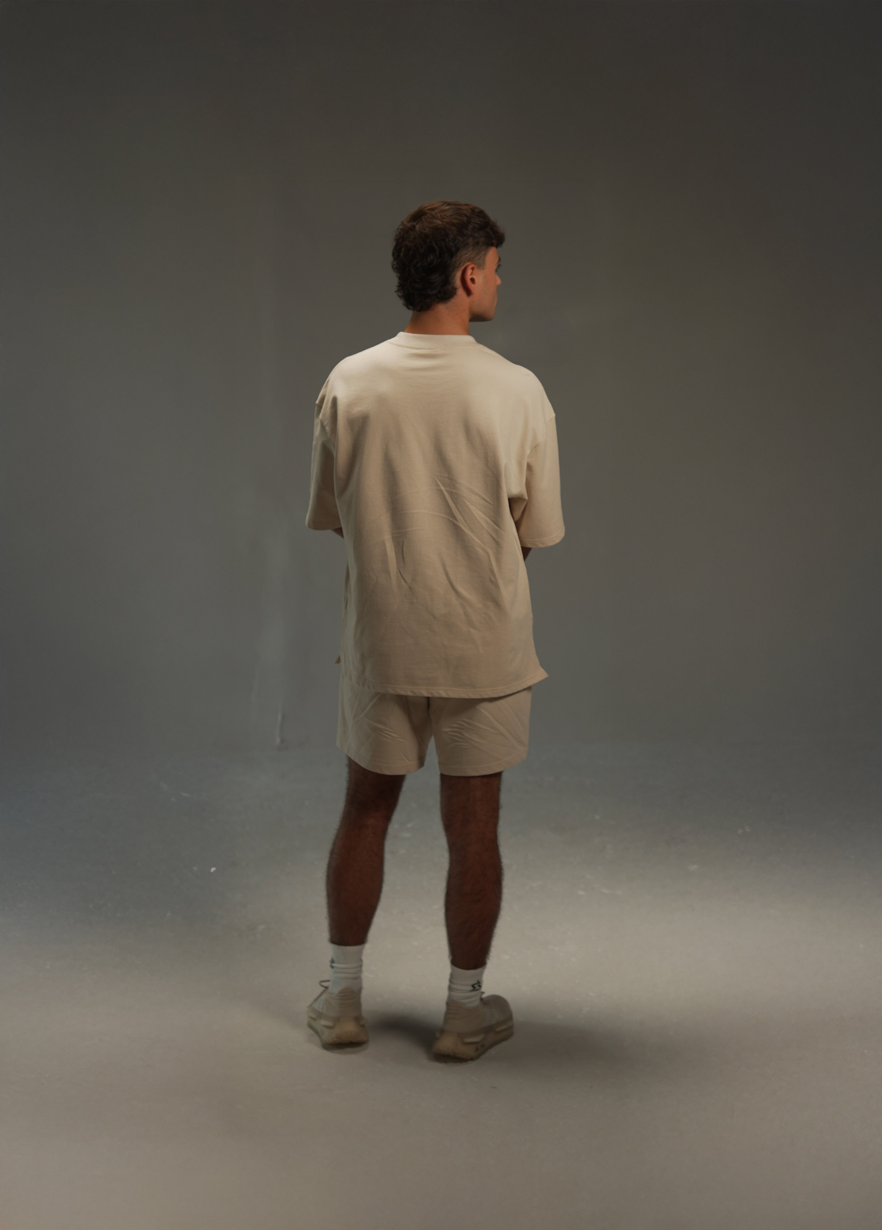 men’s relaxed sweatshirt in khaki, styled look, back view