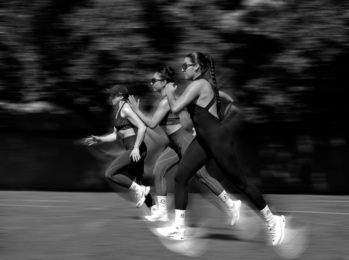 Runners in motion, photographed in black and white
