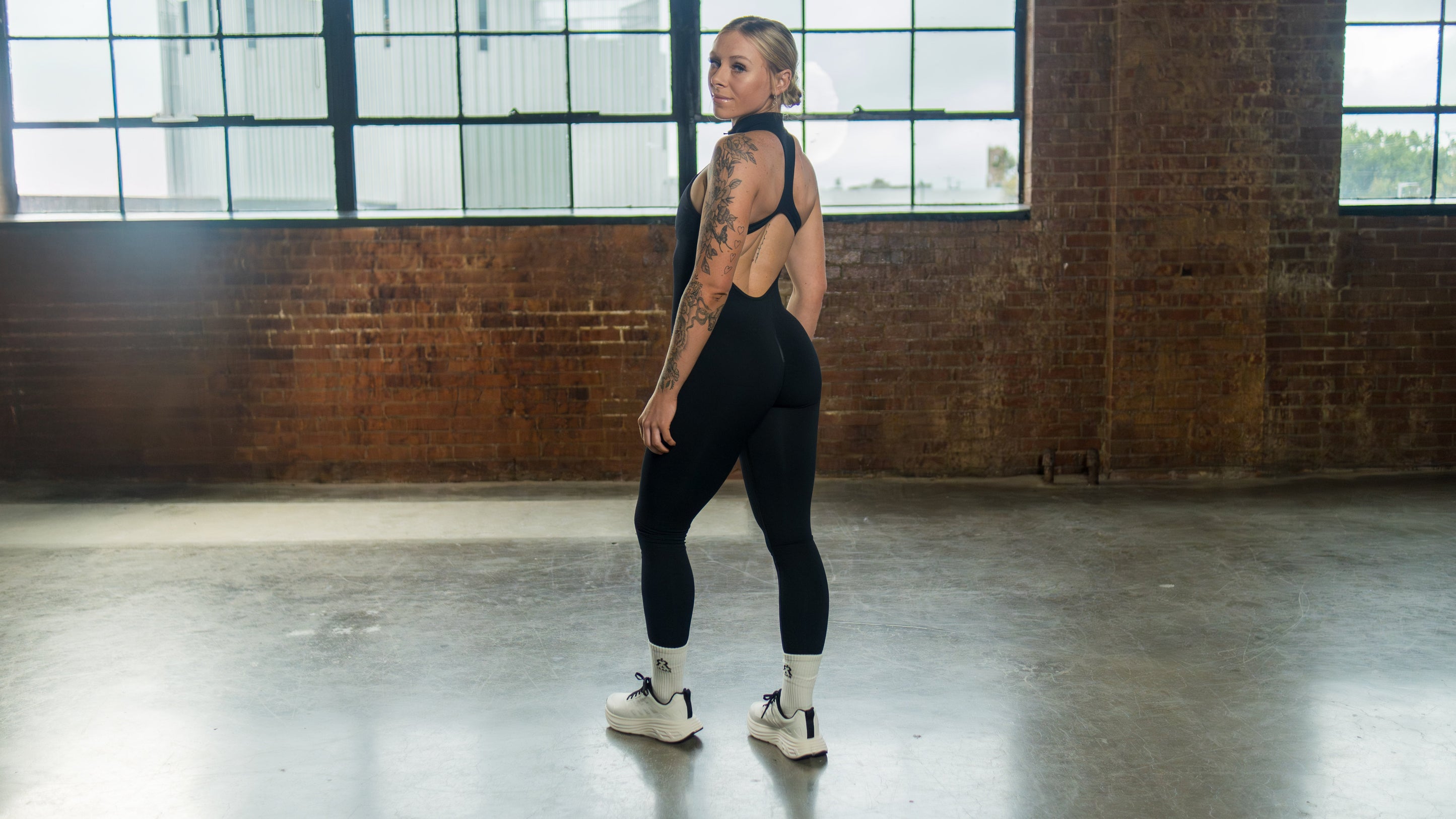 seamless open back jumpsuit in black, full back view