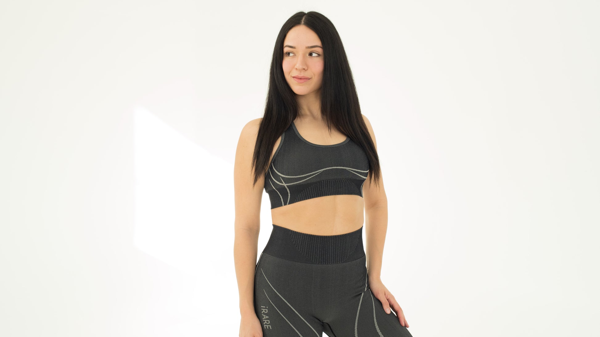 seamless sports bra in black, on-model front, studio