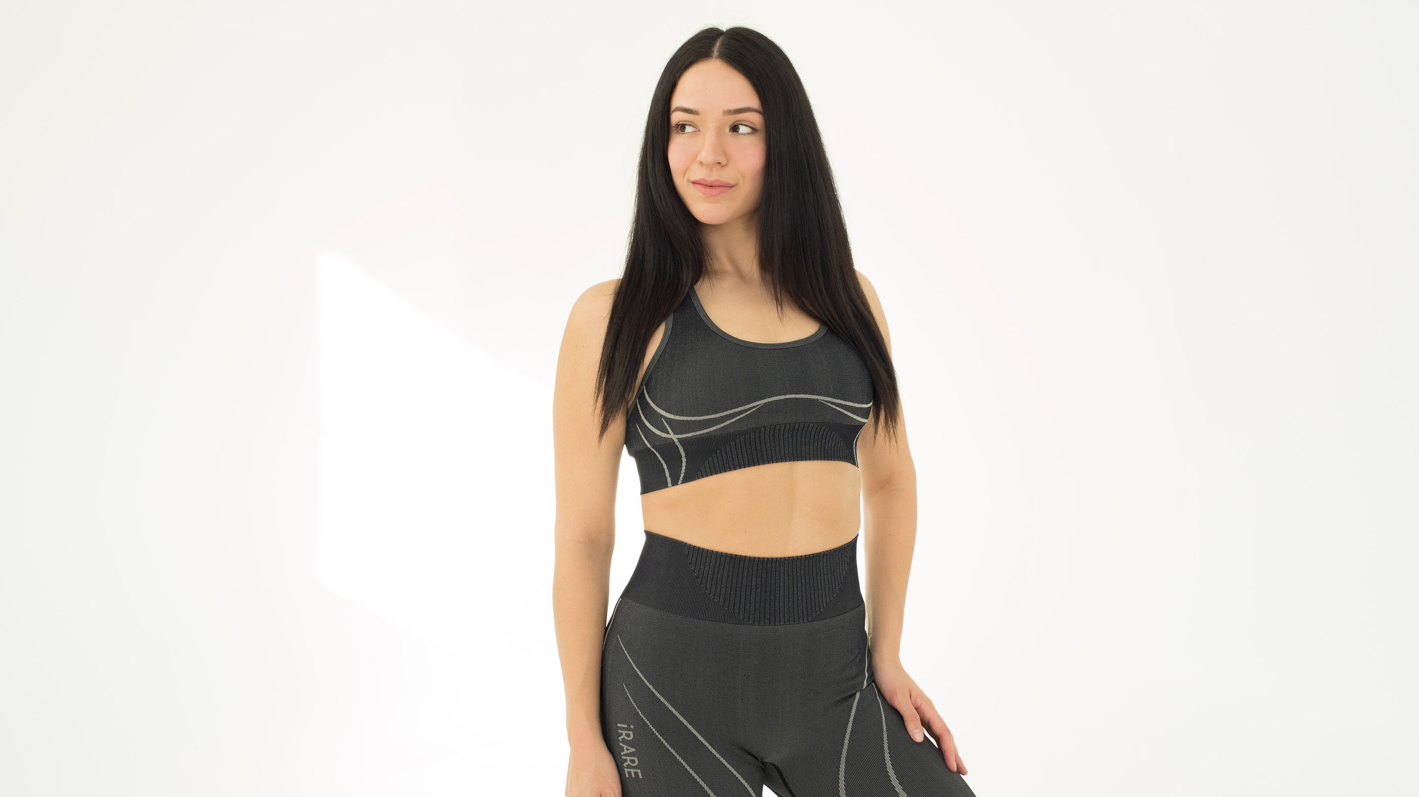seamless sports bra in black, on-model front, studio