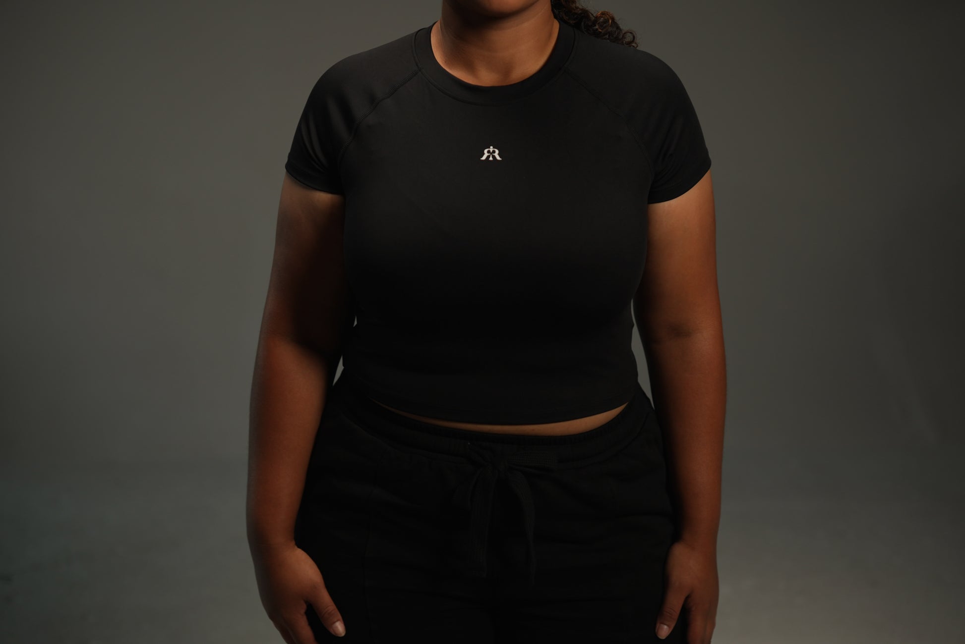 short-sleeve raglan top in black, on-model front