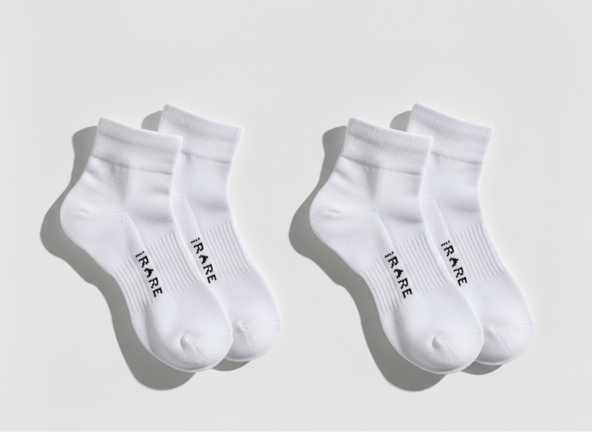 unisex ankle socks in white, two pairs flat lay on neutral background