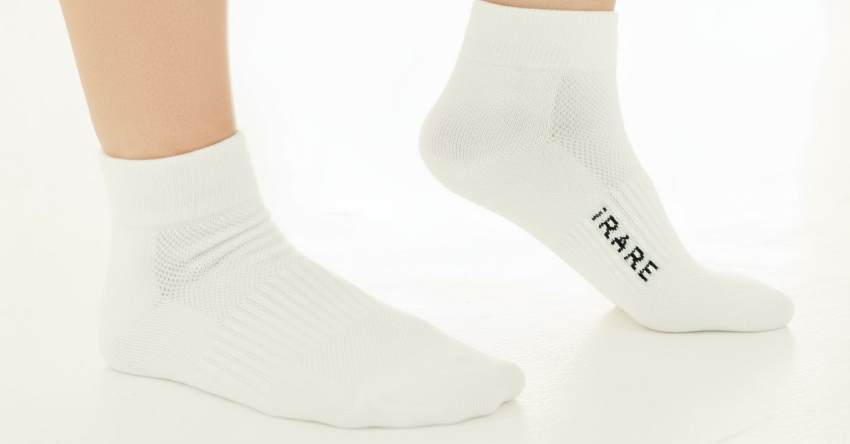 unisex ankle socks in white, two-leg view