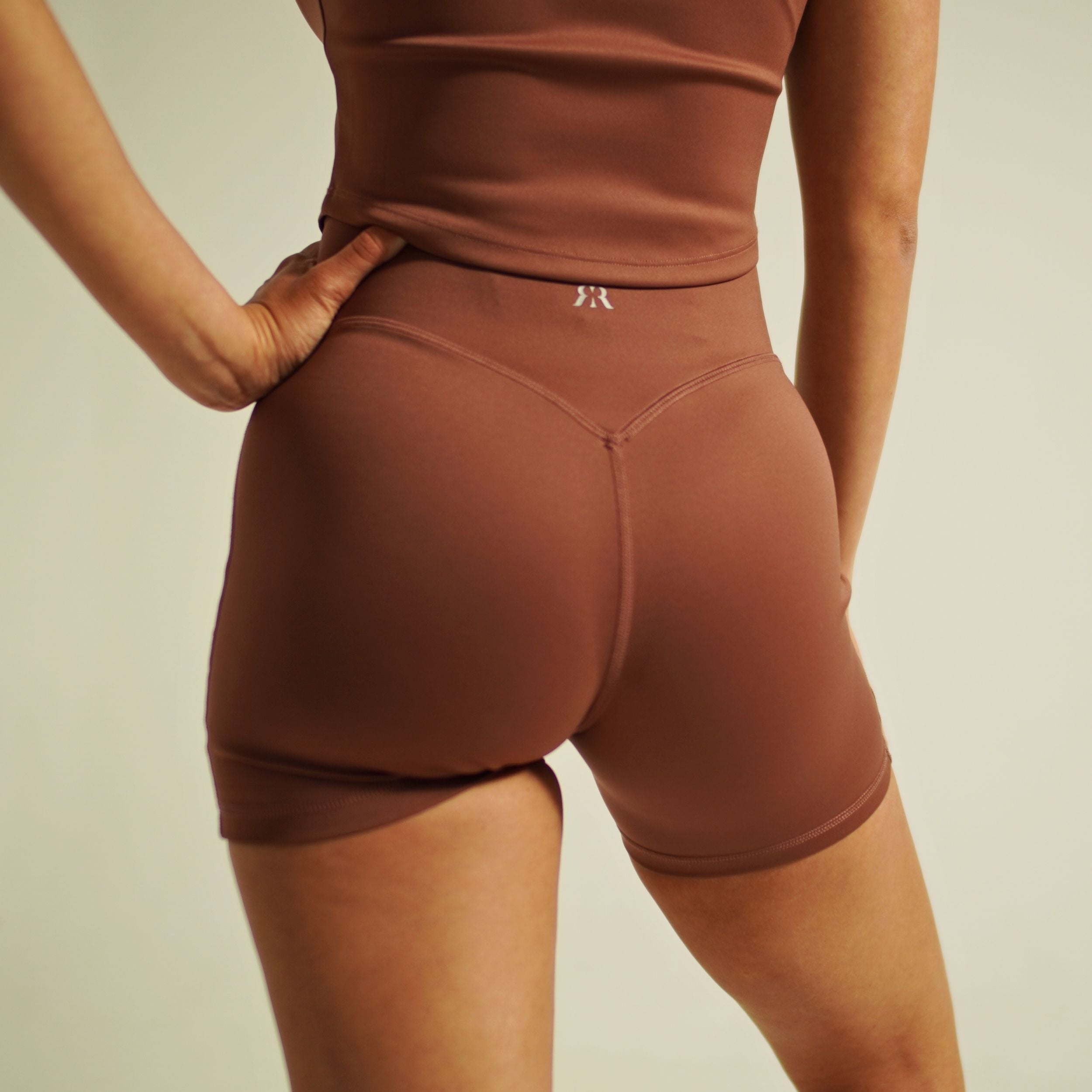 element high-rise dusty mauve shorts contour seam detail close-up
