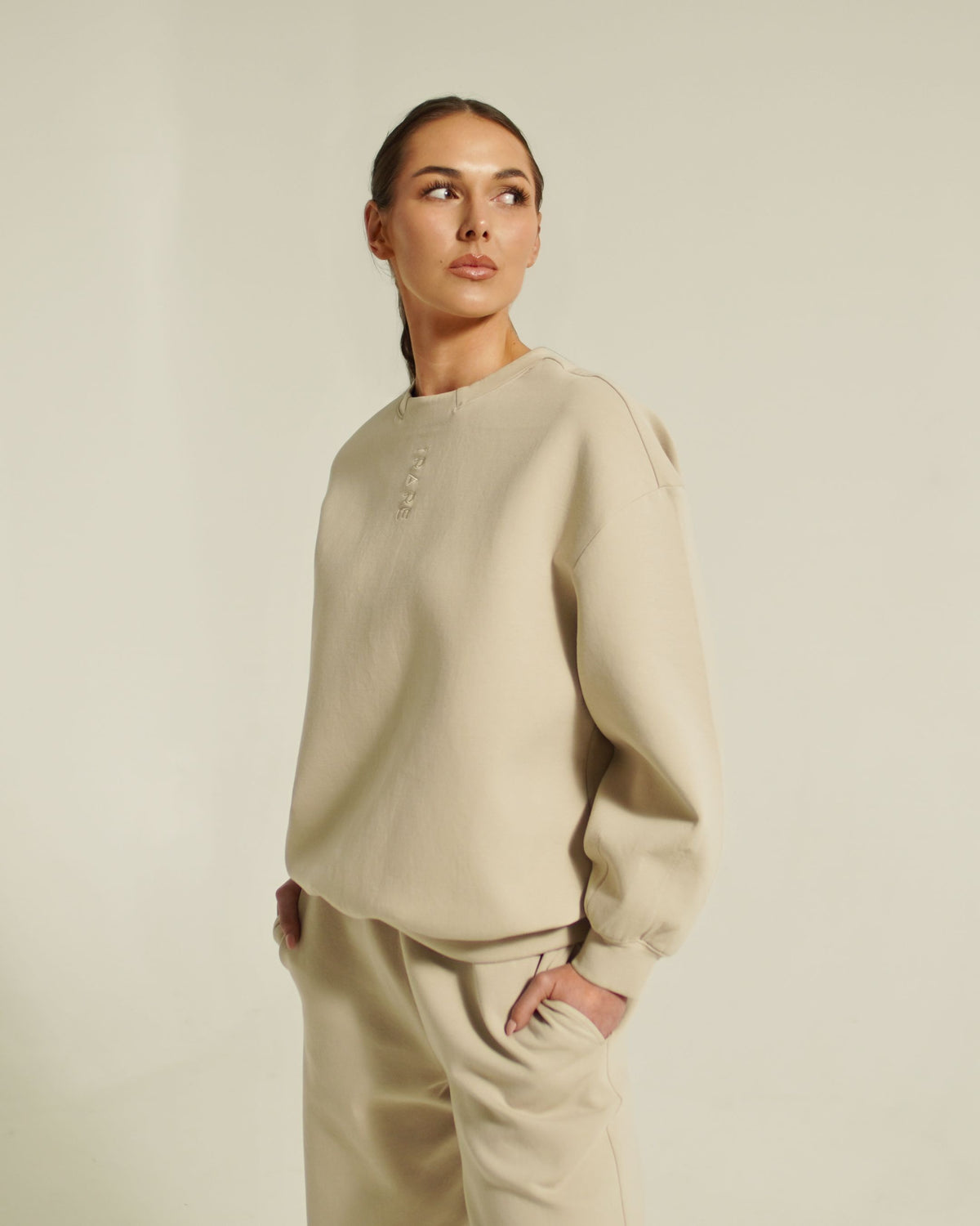 women’s FORM crew neck sweatshirt light taupe three quarter view